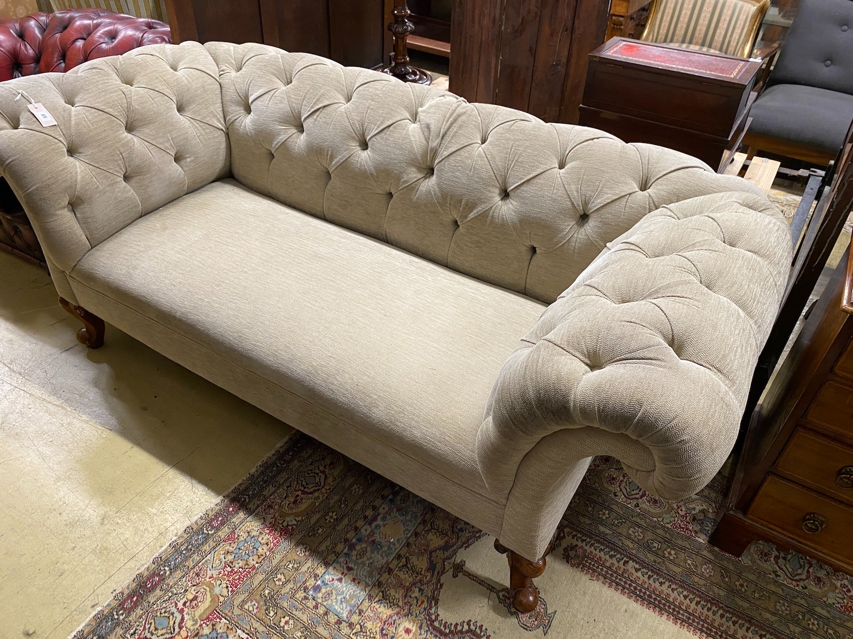 A Victorian Chesterfield settee upholstered in buttoned pale green fabric, length 190cm, width 90cm, height 75cm